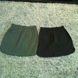 Two green and black Apana skirts-sold together